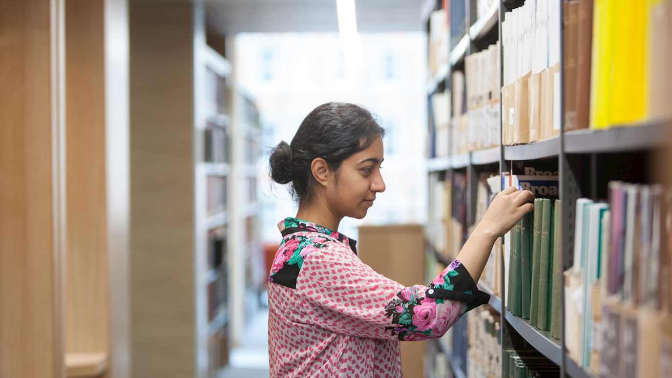 Student using institutional records in the Emily Davison Buidling