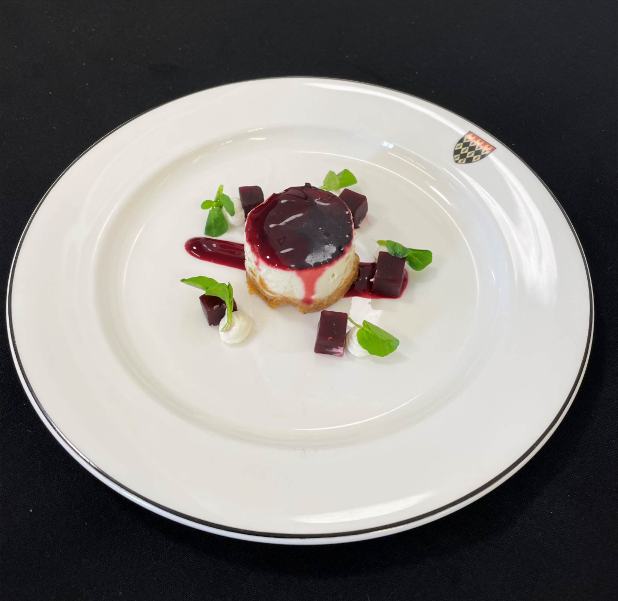 Beetroot and goat's cheese cake (v) served with a beetroot and watercress salad