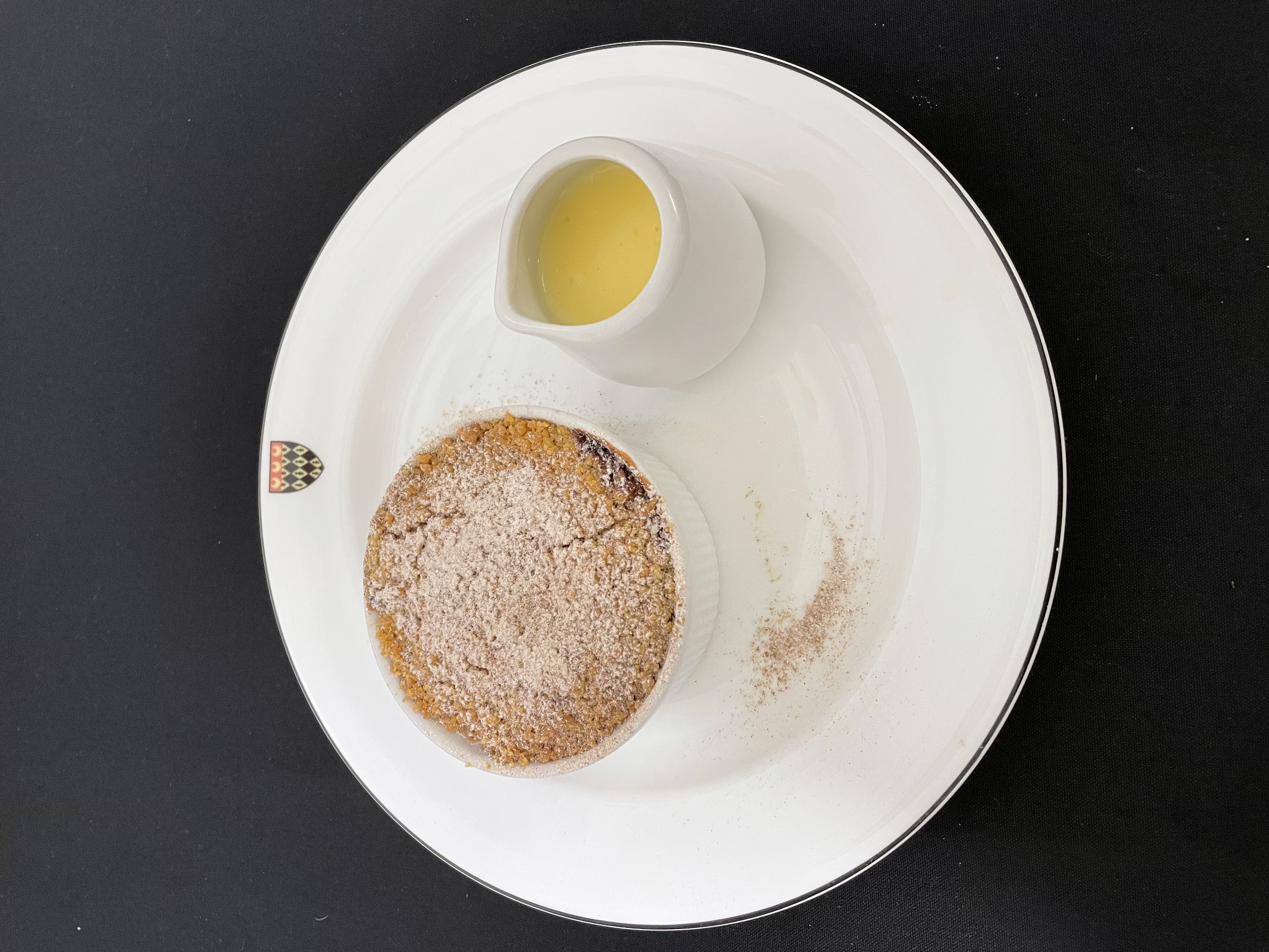 Traditional apple and oat crumble: served with crème anglaise and vanilla ice cream