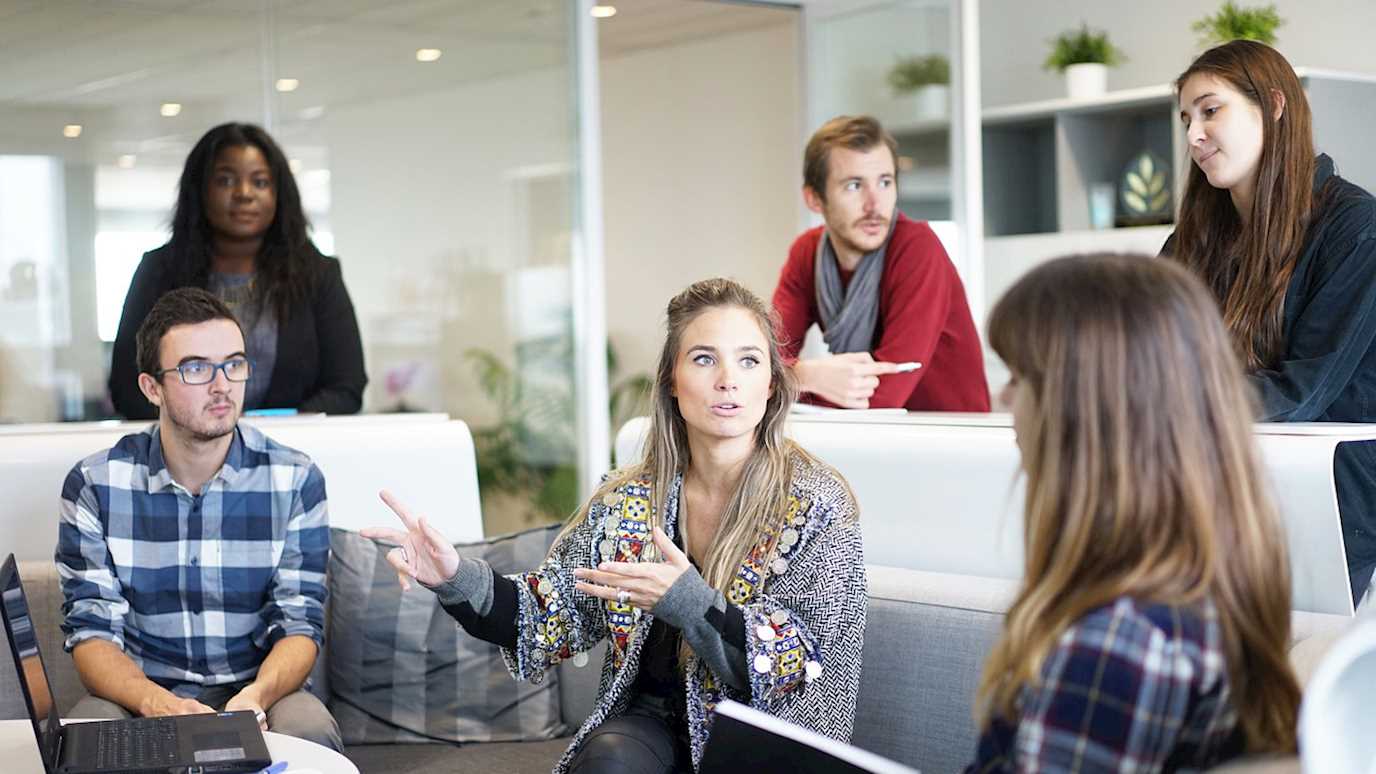 Students talking on a sofa - additional opportunities for our undergraduates